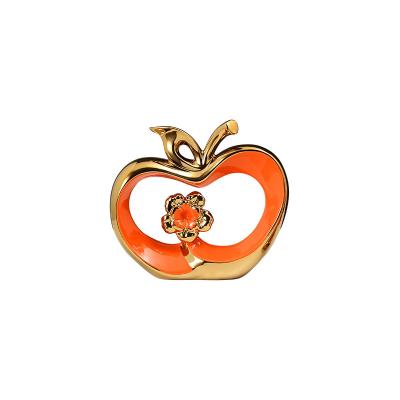 China Contemporary Elegant Gold Ceramic Ornament Table Decoration Items for Living Room Safty Fruit Decoration Luxury Apple Decoration for sale