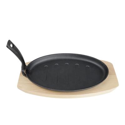 China Durable Cast Iron Sizzling Fajita Pan Japanese Steak Plate With Wooden Base For Restaurant Cooking Accessory for sale