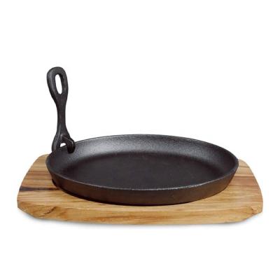 China Wholesale Durable Cast Iron Cookware Fajita Skillet Sizzler Dish Around Sizzle Dish With Wooden Base for sale