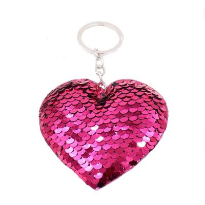 China Soft Hand Feeling Fan Shu Christmas Hand Holder Reflective Glitter Heart Shape Sequin Moving Key Chain For Girls for sale