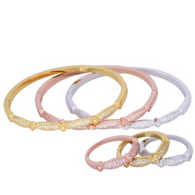 China Fashional Copper FASHION Stunned Gold Plated With Zircon Twist Shape Women Bangle Bracelet Wholesale Jewelry for sale