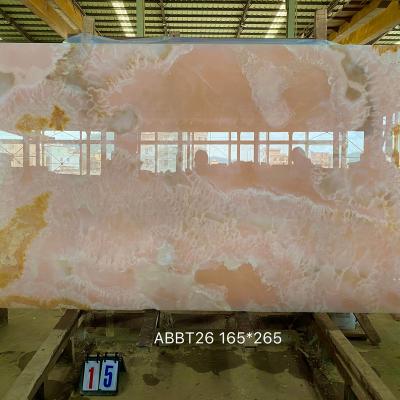 China Modern Wall Background Decoration Golden Veins Jade Backlit Pink Onyx Marble for sale