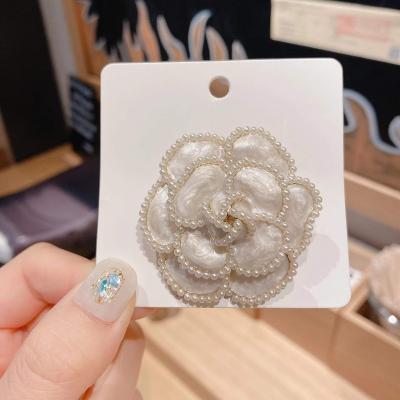 China ALLOY Style Designer Brooch Popular Brands cc Korean Brooch Women Bead Trim Camellia Flower Brooch For Women for sale