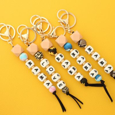 China Good Mom Key Chain Silicone Beaded Bracelet Quality New Silicone Bead Tassel Letter-Cute Wooden Key Chain As Mother's Day Gift for sale