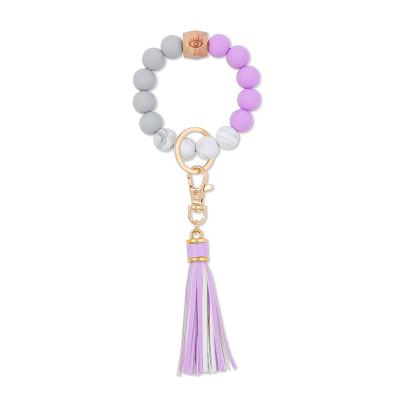 China Wholesale Price Cute Silicone Factory Lead Chain Bracelet With PU Tassel Leather Silicon Beads Wrist Key Chain for sale