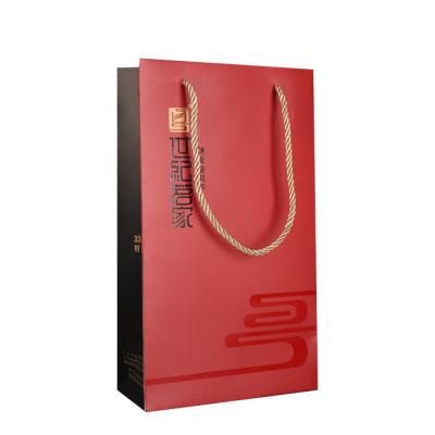 China Cheap factory price biodegradable customize art high quality red paper bag for tea/wine/bottle carry bag for sale