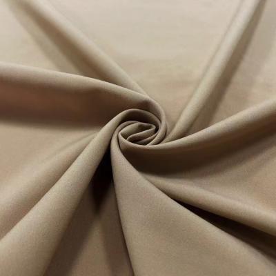 China Waterproof Yarn Dyed Fabric Stock For Clothing Pants Dress Sportswear Brown 4 Way Stretch PU Fabric for sale