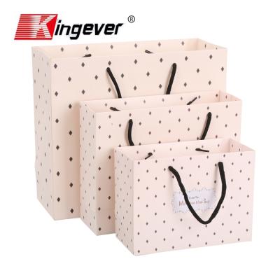 China Recyclable Custom Printed White Cardboard Paper Gift Shopping Paper Bag for sale