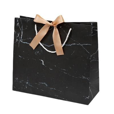 China Recycled materials low cost custom printed a3 a4 a5 standard size luxury boutique gift shopping paper bags with handle for sale