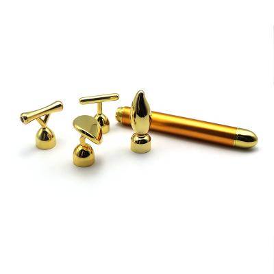 China Anti-puffiness Anti-wrinkle and eliminate circles 24k bar dark gold t-shaped gold pulse facial massager for sale