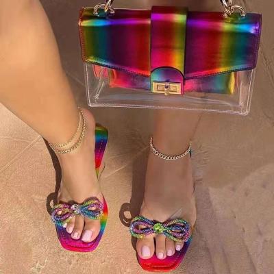 China Anti-odor hot sale fashion lady clutch purses and bling flat rainbow sandals sets jelly rainbow jelly purses for women for sale