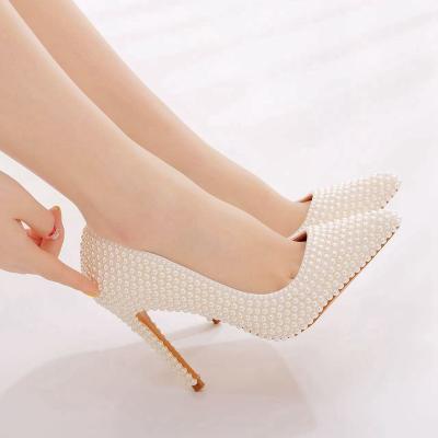 China Fashion Trend Crystal Queen Pointed Toe Beige Pearl White Wedding Shoes Bridal High Heels Party Female Pumps for sale