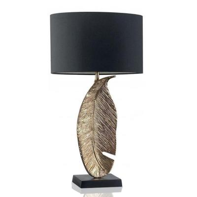 China Scandinavian Gold and Black Polyresin Leaf Table Lamp with Fabric Shade for Living Room Bedroom and Hotel Decoration Table Light Table Lamp for sale