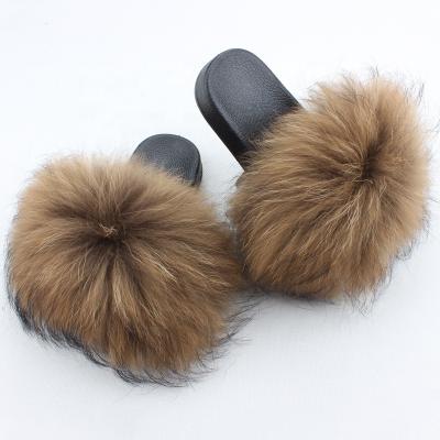 China Hot Selling Lightweight Fluffy Fur Slippers For Ladies Raccoon Fur Slides Slippers Luxury Women With Fur for sale