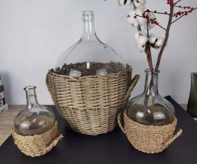 China Luxury Custom Morden Tall And Huge Glass Bottle Vase With Rattan Wrapped Basket for sale