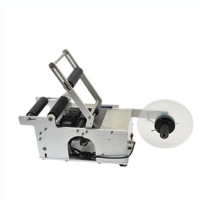 China MT-50 Small Semi Automatic Food Label Sticker Machine Operated By Hand for sale