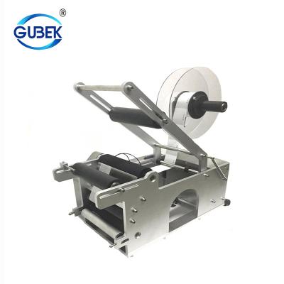 China MT-50 Food Labeling Machine Metal Round Bottle Semi Automatic Label Stick Machines for sale