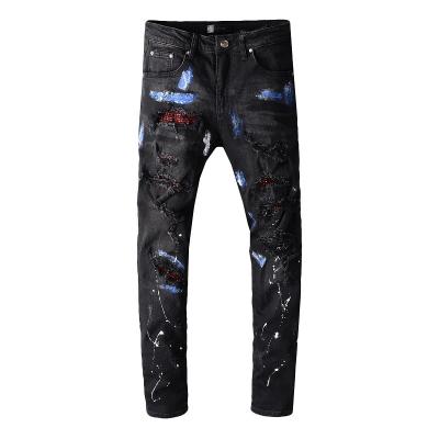 China Viable Wholesale Men's Ripped Rhinestone Patched Splatter Jeans for sale