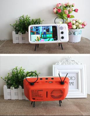 China Outdoor Classic TV Style Mini Portable Speaker With Phone Wireless Stand for sale