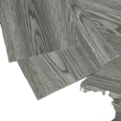 China Traditional self-adhesive PVC flooring bonded modern LVT reinforced wear-resistant imitation wood grain pattern. for sale