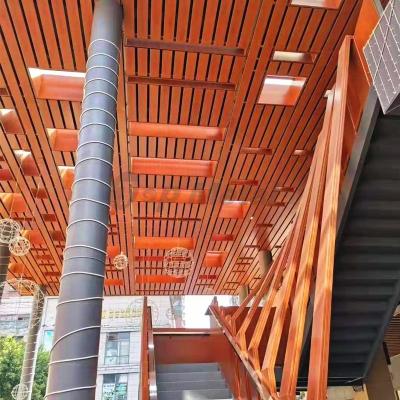 China Decorative Outdoor Embedded Stretch Ceilings Panel Linear Suspended Metal Wood Color Aluminum Strip Ceiling Design For Interior Decor for sale