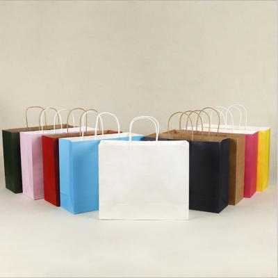 China Disposable Luxury Custom Size Package Paper Handle Paper Bag Kraft Paper Shopping Bag for sale