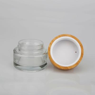 China Eco-friendly packaging tarro cosmetic blanco madera 30ml 100ml cosmetic face skin cream cosmetic glass jar tapa with wooden lid bamboo for sale