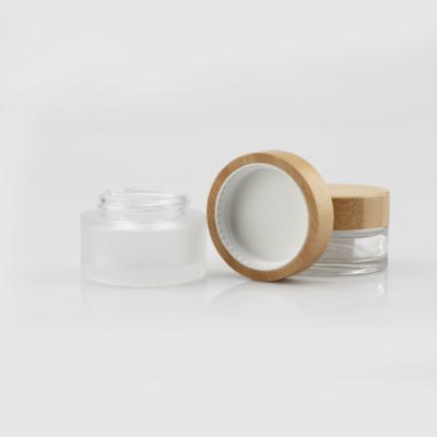 China Cosmetic Bamboo Cosmetics Packaging Containers Frosted Glass Cosmetic Cream Jars With Bamboo Wooden Lids for sale