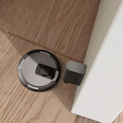 China Easy Installation Door Stopper Spring Door Stopper Zinc Alloy Round Floor Mounted Under Door Draft Stoppers for sale