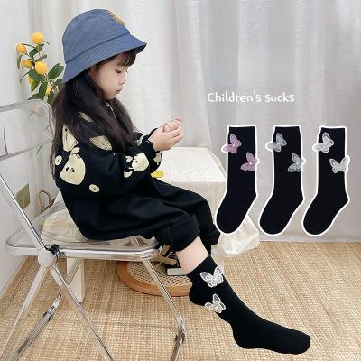 China HIGH STREET 2022 fashion babies cotton knee high socks black socks butterfly decorations 1-9 years old kids for sale