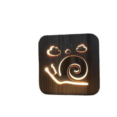 China Lighting Hot Selling 3D Snails Shape Wooden Carved Decorative Table Lamp USB Desk Lamp for sale