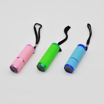 China Led emergency 9 torch mini pocket torcia led flashlight multicolor EDC silicone led flashlight for sale