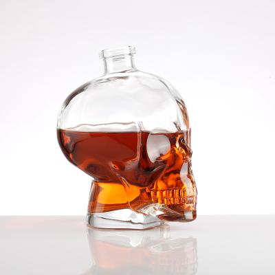 China Wishing Creative Design 380ml 500ml 700ml 1000ml Skull Shape Transparent Whiskey Vodka Brandy Liquor Glass Bottle With Cork for sale