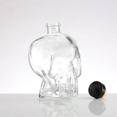 China Wish Skull High Quality Glass Bottle Mini Wine Tequila Bottle With Aluminum Lid for sale