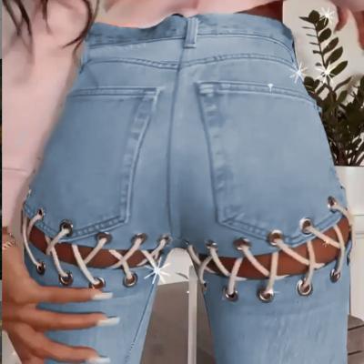 China Anti-wrinkle fashion streetwear woman high waist pants cool girls hollow out jeans pants lace up girls pants for sale