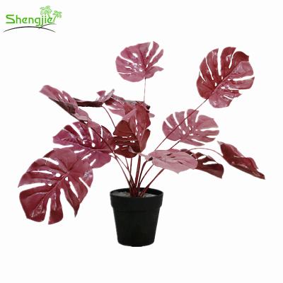 China Durable Ornamental Artificial Tropical Plant Small Foliage Mostera Potted Plant for sale