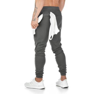 China Custom Made Men Breathable Hide Polyester Cargo Drawstring Track Quick Dry Stacked Pants Jogging Pants Zipper Pocket Sporty Sweatpants for sale