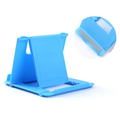 China Customized Adjustable LOGO Universal Folding Table Plastic Cell Phone Holder Stand Desk Stand Mobile Phone Stand Foldable Stand for sale