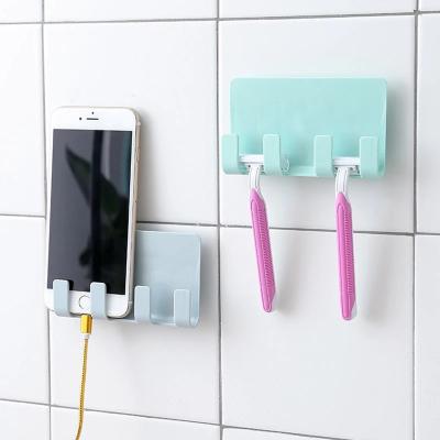 China Compatiable with Multifunctional Ipad Bathroom Suction Wall Phone Holder for Charging Cable Phone Hanging Holder on the Wall for sale