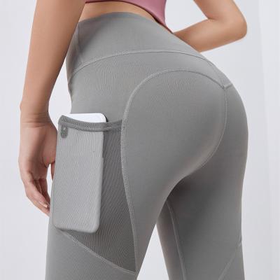 China TikTok Famous Breathable Yoga Pants With Pockets For Women Fitness Women Seamless Gaiters Elastic Waist Lift Up Higher Waist for sale