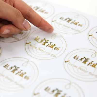 China Waterproof Clear Lip Gloss Gel Brow Sticker Private Label, Custom Transparent Cosmetic Jar Round Gold Foil Adhesive Labels for sale