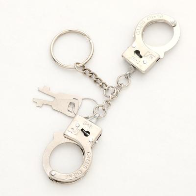 China Christmas Wholesale OEM Manufacturer Private Label Handcuffs Toys Creative Metal Key Chain for sale