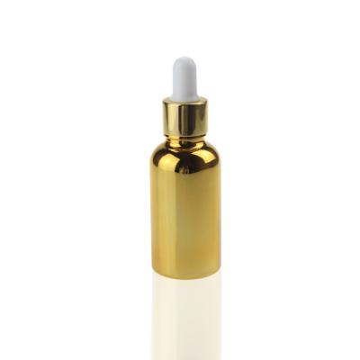 China Glass Bottle With Wholesale High Grade Gold Glass Essential Oil Dropper Bottle With Dropper Cap 30ml, High Temperature Gold Plated 1oz Glass Oil Bottle for sale