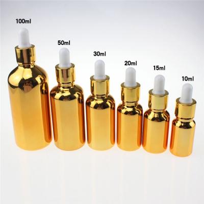 China Wholesale Personal Care Gold 100ml Essential Oil Dropper Glass Bottles Large, Empty Gold Perfume Bottle With Dropper for sale