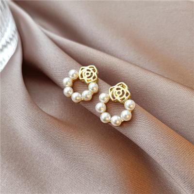 China Fashionable S925 Needle New Rose Earrings Sweet Simple Advanced Silver Pearl Camellia Romance Women's Earrings for sale