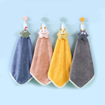 China Disposable Cute Monster Coral Fleece Absorbent Hand Towel With Hangable Monster Head for sale