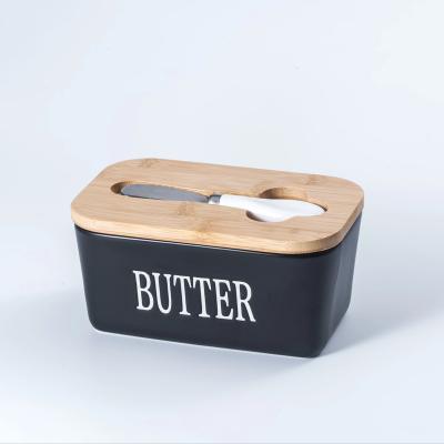 China Freshness Preservation 650ML Hot Sale stoneware food storage Ceramic Butter Keeper Dish With Bamboo Cover And Butter Knife for sale