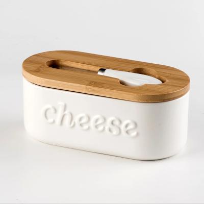 China Freshness Preservation High Quality oval solid white Cheese Box Ceramic Butter Box Cheese Dish With Bamboo Lid And Knife for sale