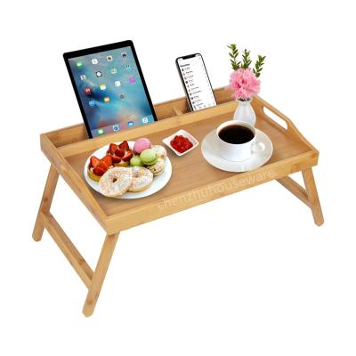 China Trapezoid Foldable Natural Bamboo Table With Foldable Legs Used As Breakfast Table And Laptop Desk for sale