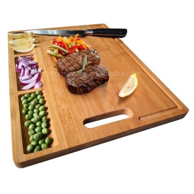 China Sustainable cutting board with separate handle and 3 compartments natural bamboo chopper for sale